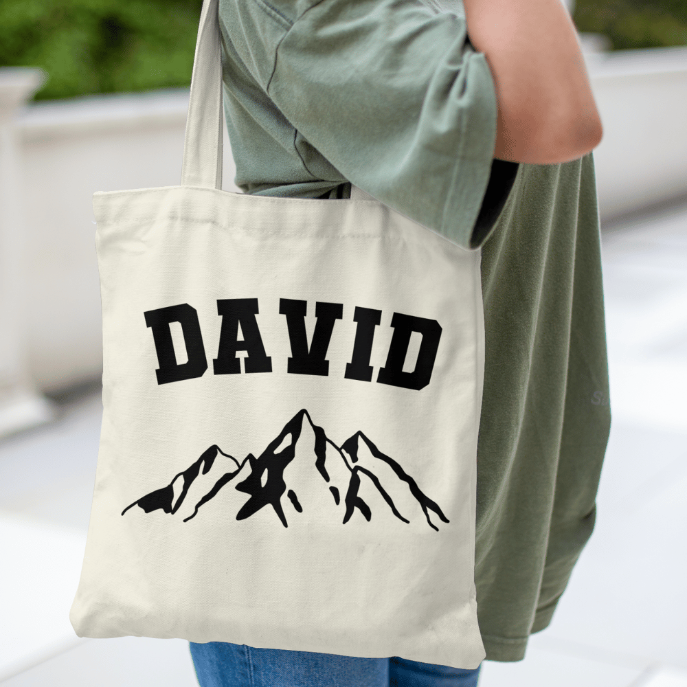 Personalise this mountain tote with any name! A rugged, eco-friendly cotton bag perfect for hikers, campers, or outdoor-loving gift seekers.