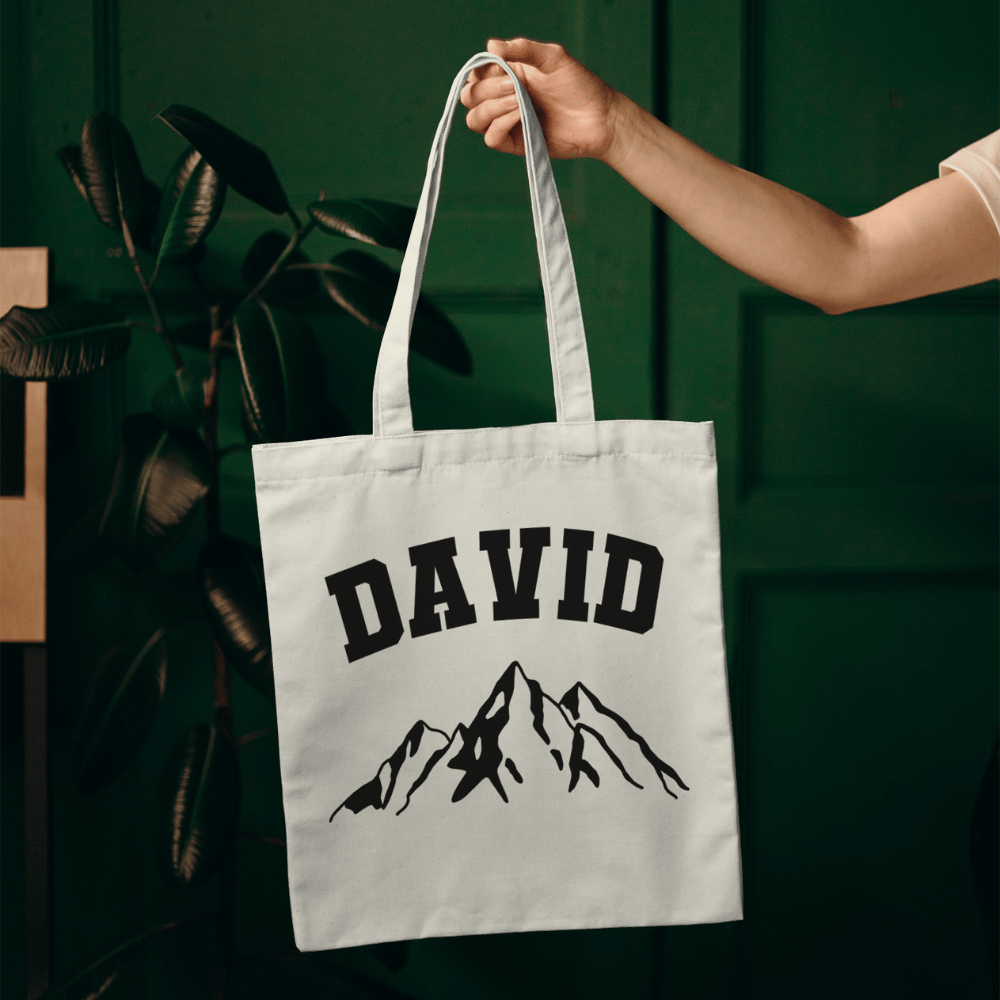 Personalise this mountain tote with any name! A rugged, eco-friendly cotton bag perfect for hikers, campers, or outdoor-loving gift seekers.