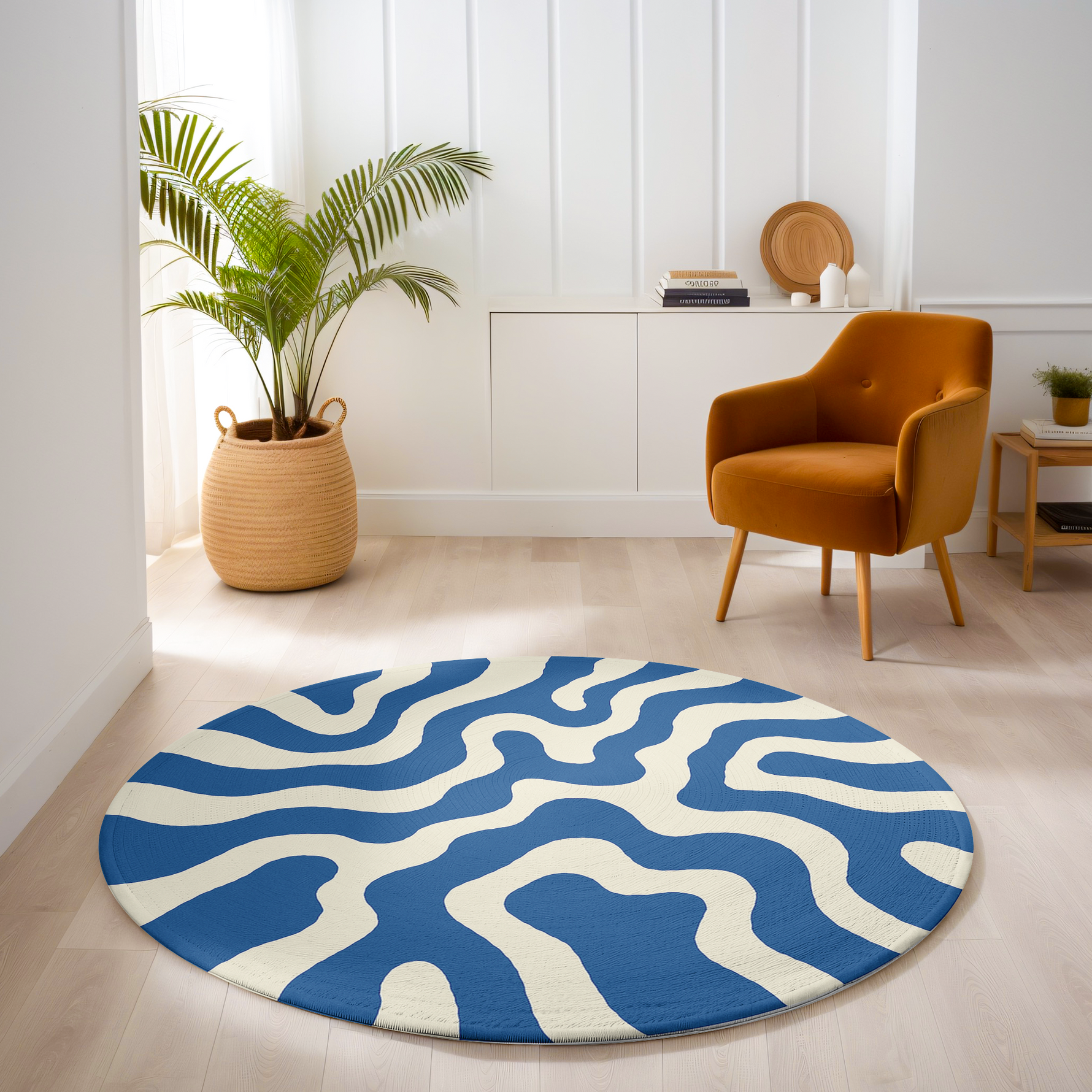 Blue and white circular rug featuring a wavy line design, styled in a cozy, well-lit space.