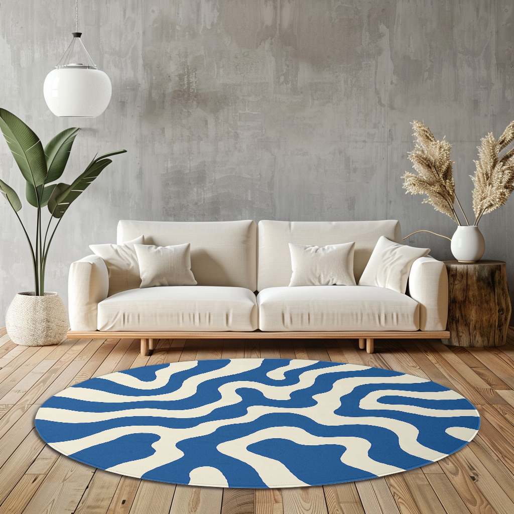 Blue and white circular rug featuring a wavy line design, styled in a cozy, well-lit space.