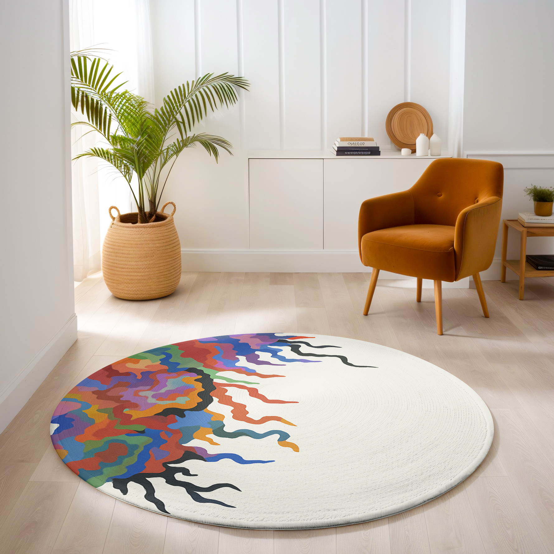 Round rug with flowing abstract multicolor design in red, purple, orange, teal, and black on a clean off-white background in a modern room.