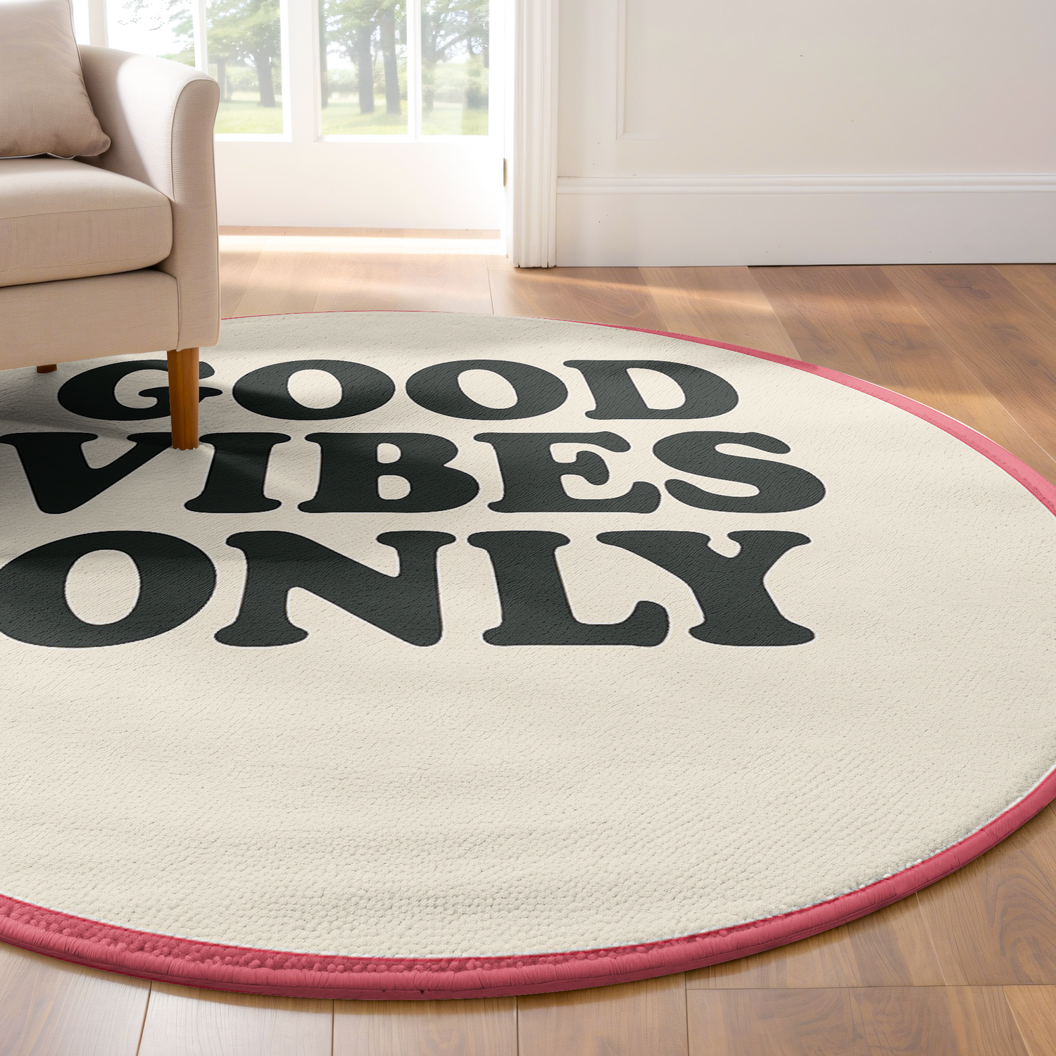 Round cream rug with bold black text reading “Good Vibes Only” and a pink border, designed in a playful retro style.