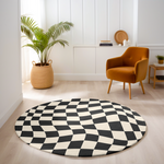 Round rug with black and white wavy checkerboard pattern, styled in a bright, modern room with wood flooring and minimal furnishings.