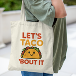 Tote bag with colourful quote “Let’s Taco ’Bout It” and cute smiling taco graphic