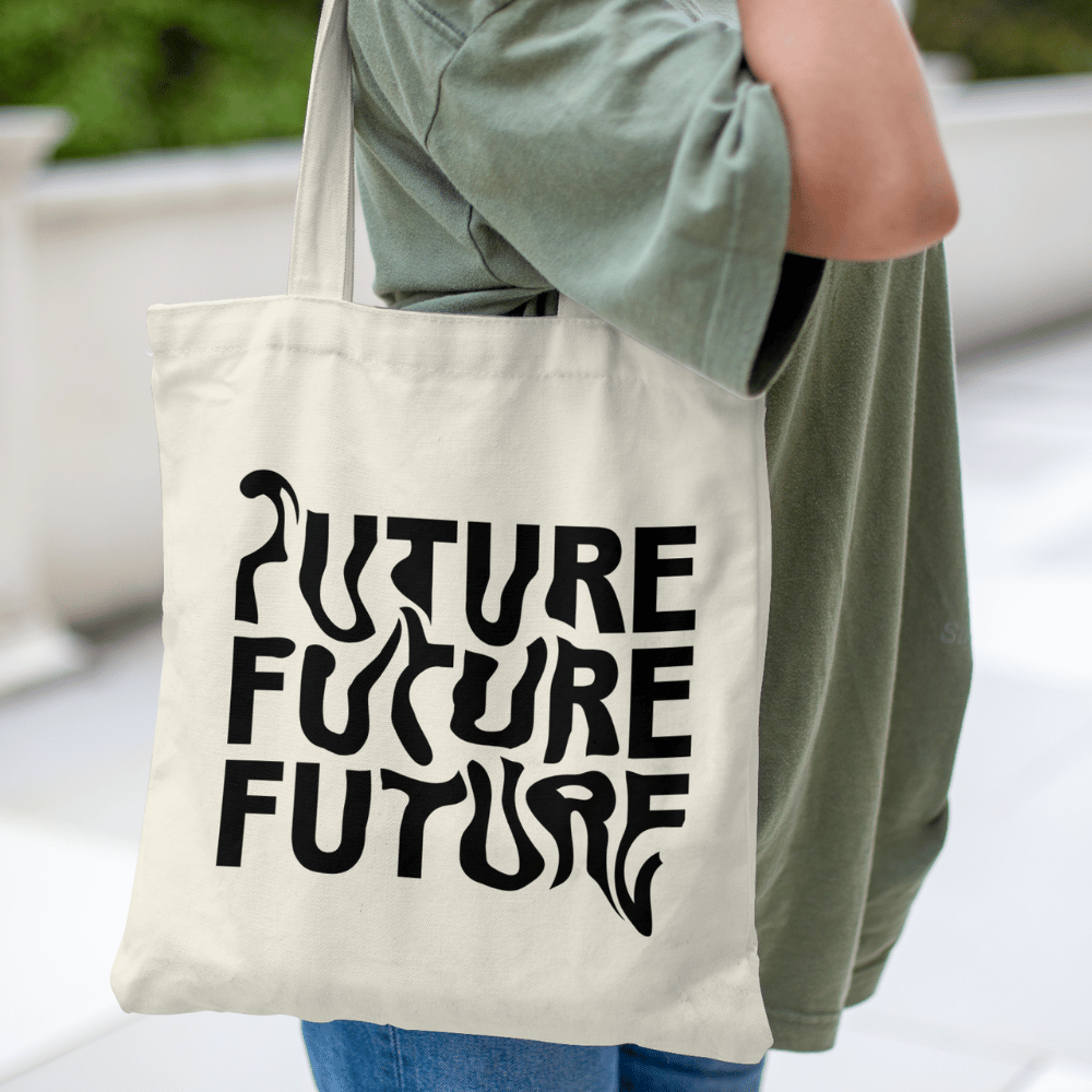 Tote bag with warped black text repeating “FUTURE FUTURE FUTURE” – modern cotton canvas bag held on shoulder, minimalist design