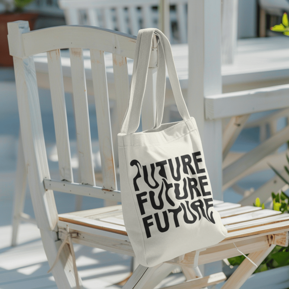 Tote bag with warped black text repeating “FUTURE FUTURE FUTURE” – modern cotton canvas bag held on shoulder, minimalist design