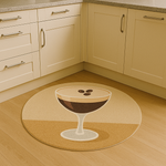 Round rug with a stylized espresso martini glass design in warm beige and brown tones on a carpeted floor.