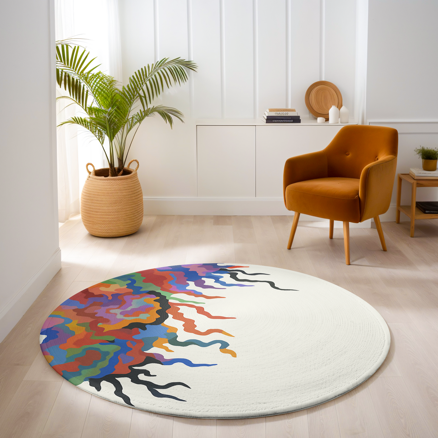 Round rug with flowing abstract multicolor design in red, purple, orange, teal, and black on a clean off-white background in a modern room.