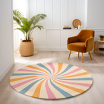 Round rug with pastel swirl design in blush pink, soft blue, golden yellow and ivory, styled in a clean, modern interior.