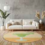 Round rug with a green margarita cocktail illustration and lime slice on a soft beige background, styled with bold, modern simplicity.