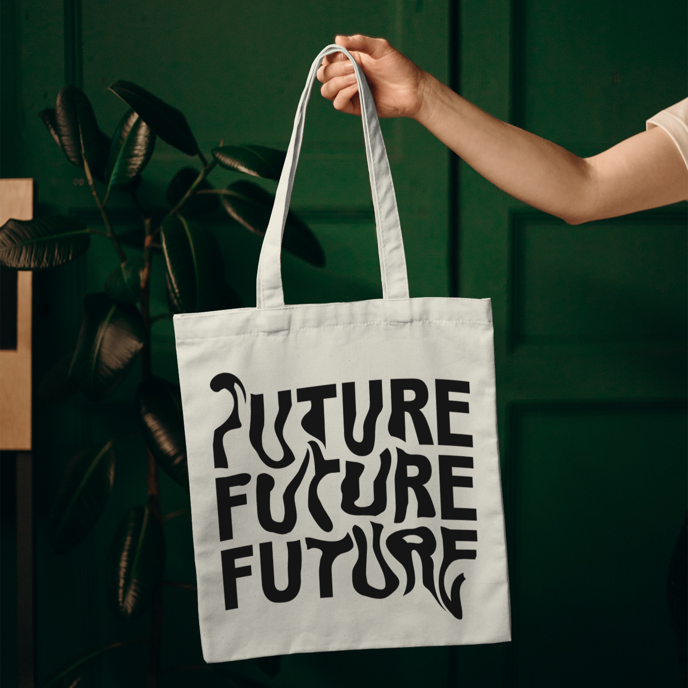 Tote bag with warped black text repeating “FUTURE FUTURE FUTURE” – modern cotton canvas bag held on shoulder, minimalist design