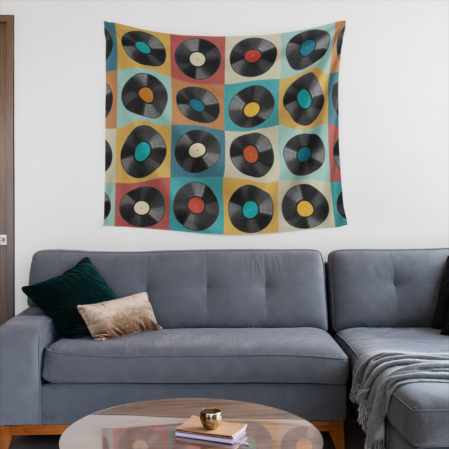 A tapestry design featuring a grid of vinyl records with various colored labels, set against a background of retro-style squares in red, blue, yellow, beige, and teal tones.