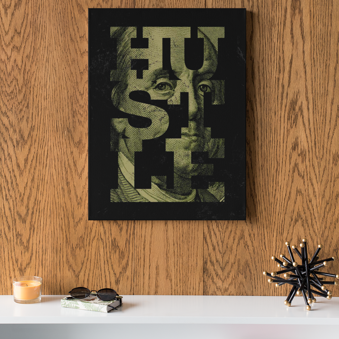 HUSTLE canvas poster featuring bold block lettering over a gritty grayscale portrait of Benjamin Franklin, stretched on a wooden frame, wall-mounted for modern motivational decor.