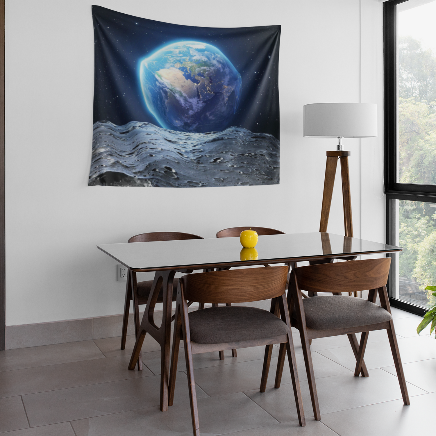 A tapestry image showing planet Earth rising above the moon’s surface, with detailed craters in the foreground and a star-filled galaxy in the background.